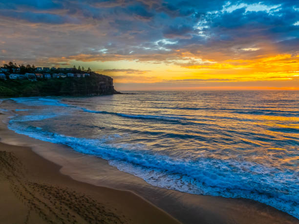 istock Pretty Sunrise at the seaside with rain clouds 2187069106