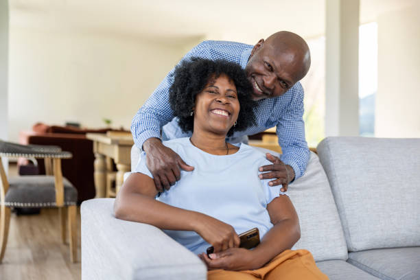 istock Affectionate senior couple smiling at home 2187069465