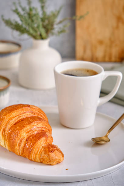 istock Fresh croissant on a white plate 2187070092