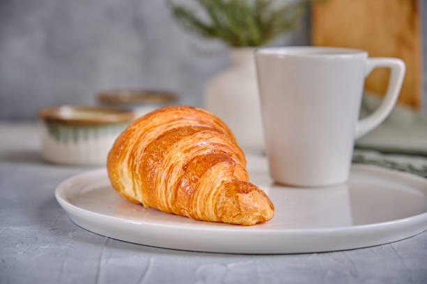 istock Fresh croissant on a white plate 2187070098