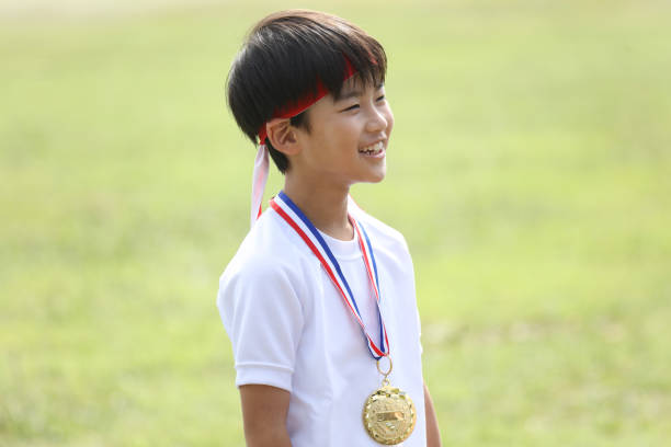 Smiling boy wearing a medal