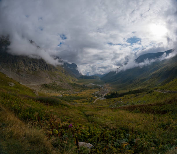 istock Majestic Mountain Valley Under Dramatic Cloudy Sky 2187071360