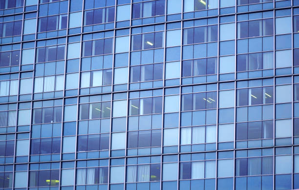 istock close up on modern office building with blue glass windows 2187072409