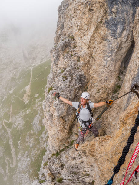 istock Female Mountain Climber on Rocky Terrain 2187073230