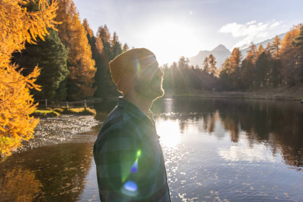 istock Smiling Man in Autumn by a Lake 2187073779