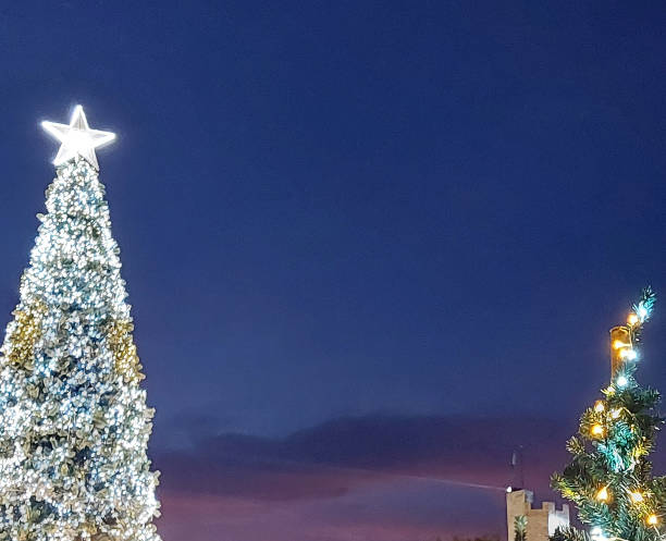 istock A nighttime scene of a Christmas tree beautifully adorned with lights 2187075413