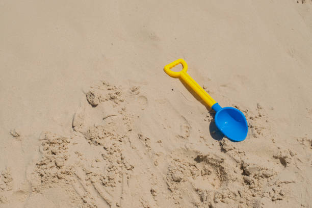 kid toy on the beach , Hoe
