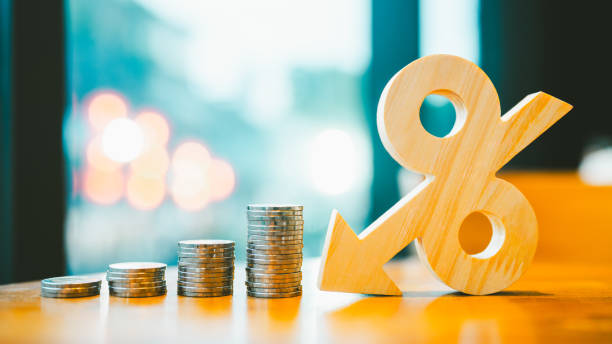 istock Percentage model, coin stack and down arrow, concepts for success, methods, systems of raising or lowering Fed interest rates to correct inflation concepts. 2187078874