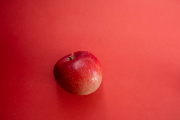 Delicious apples on a red background