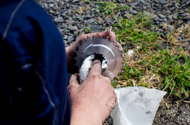 A child cleans the sprocket of his sports car.Preparing for the race. Sports car repair