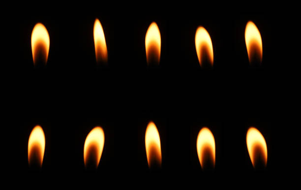 istock Set candle flame glows in the dark on a black background, Candlelight yellow glows isolated is divided into ten parts on the black background. 2187082422