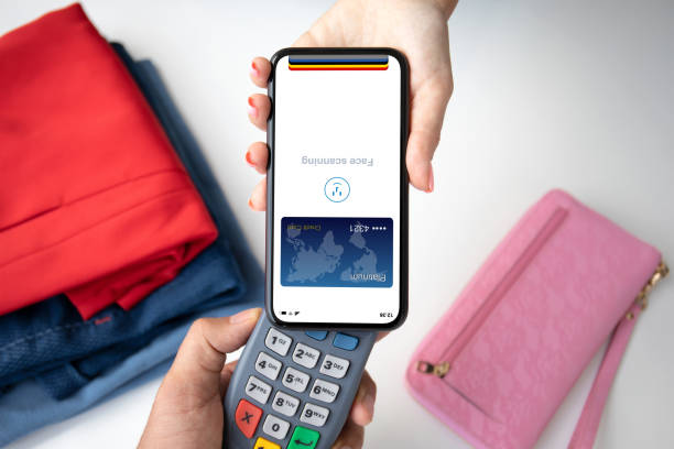 istock woman payment purchase for phone and pay pass online terminal 2187083750