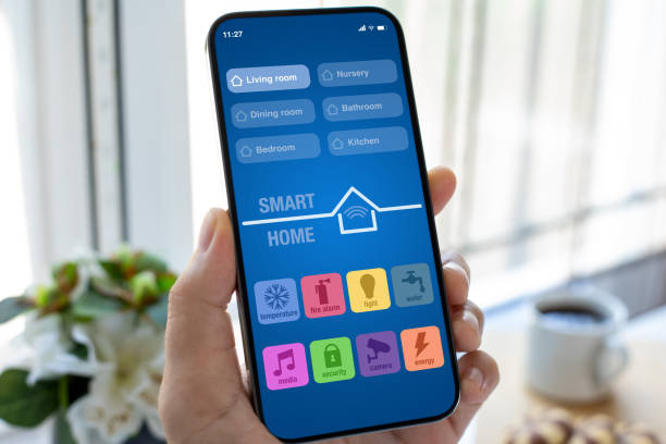 male hand holding phone with smart home app on screen