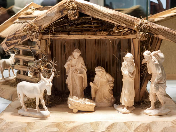 istock A wooden Christmas Nativity scene illuminated at night 2187084076