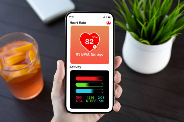 istock woman hand hold phone with app heart and activity screen 2187084169