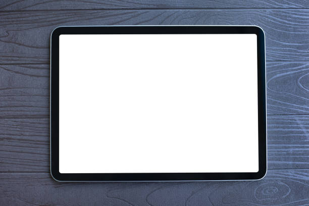 istock computer tablet with isolated screen background wooden table in office 2187084211