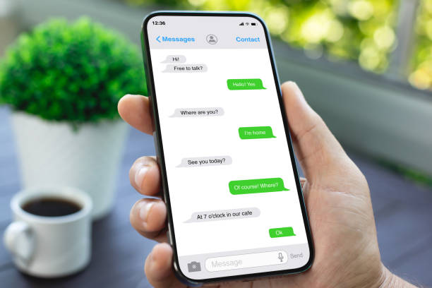 istock man hand hold phone with app messenger on the screen 2187084272