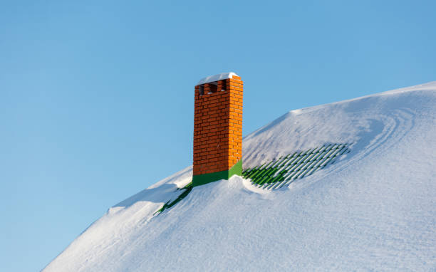 istock A brick chimney is covered in snow 2187084423