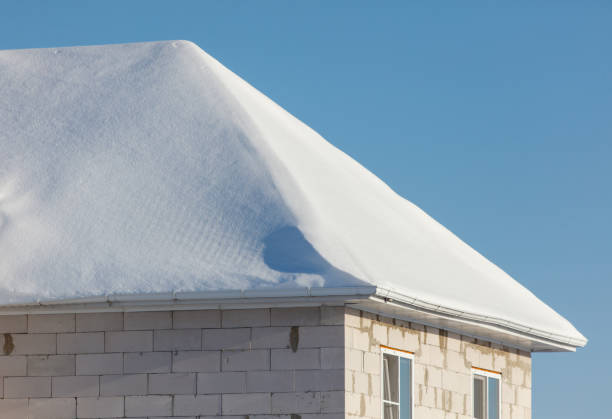 istock A house with a snow covered roof 2187084490