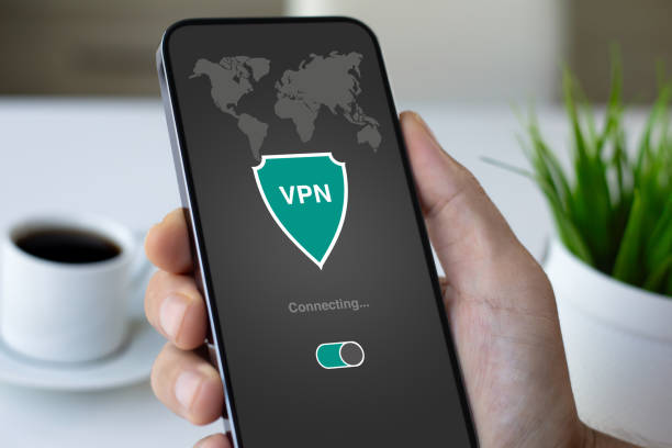 istock male hand holding phone with app vpn on the screen 2187085033