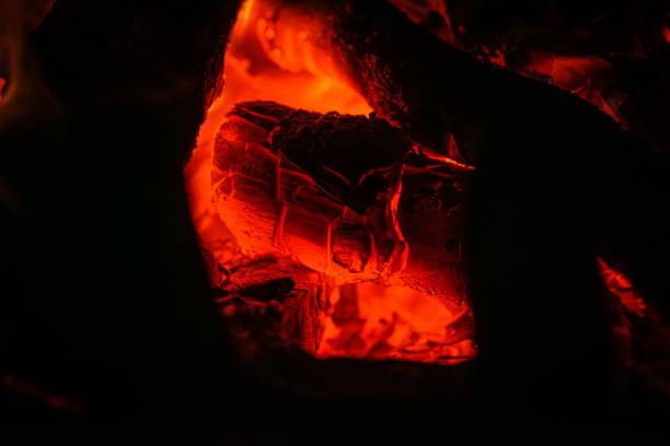 A close-up view of a flame glowing in a dark setting
