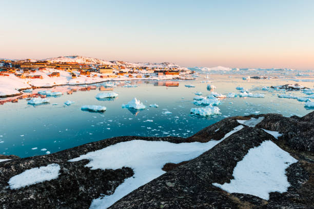 istock Glacier-filled waters and a snowy village 2187085718