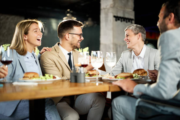 istock Happy business team having lunch in a restaurant. 2187085739