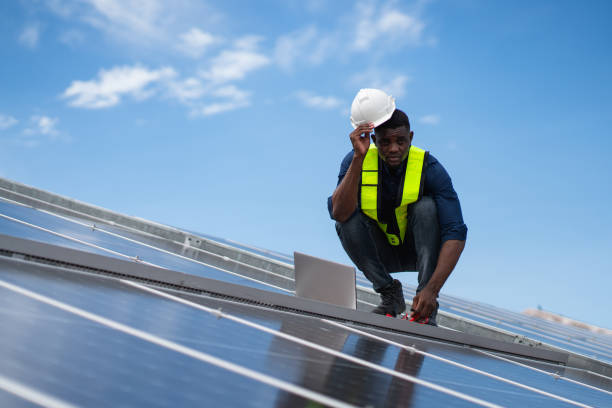 istock Service engineer checking solar cell on the roof for maintenance if there is a damaged part. Engineer worker install solar panel. Clean energy concept. 2187086102