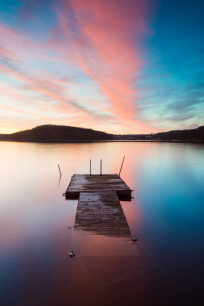 istock Jetty in lake at sunrise 2187086366