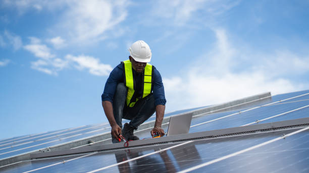 istock Service engineer checking solar cell on the roof for maintenance if there is a damaged part. Engineer worker install solar panel. Clean energy concept. 2187086372