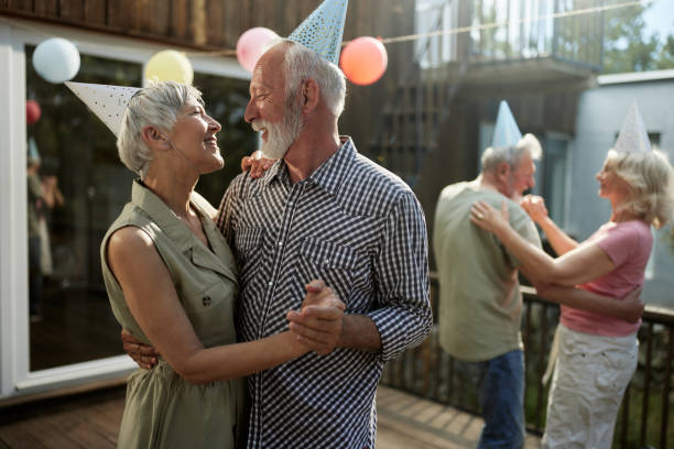 istock Happy senior couples dancing during a Birthday party on a terrace. 2187087945