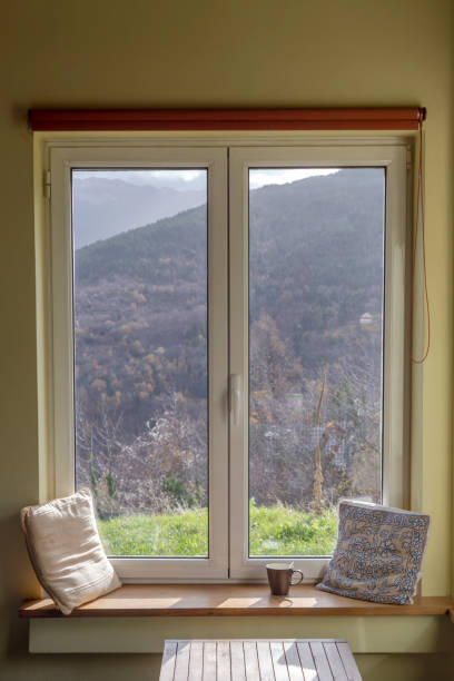 istock View from the closed window to the mountains 2187090026