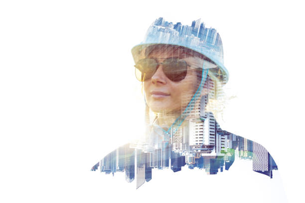 The double exposure image of the engineer thinking overlays with cityscape image with copy space. The concept of engineering, construction, futuristic and industry.