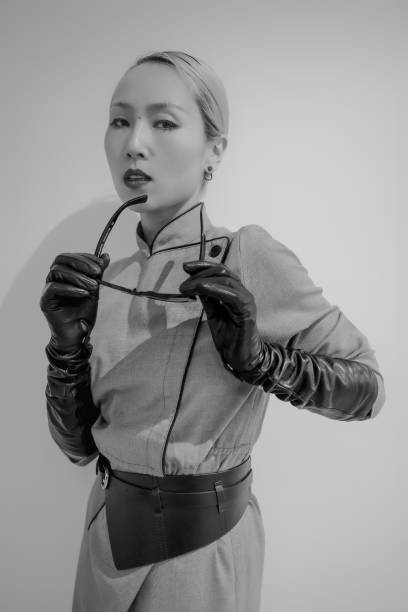 Photo of an angry young woman. She has put her fists up and is ready for the fight..