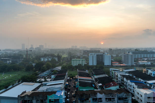 istock Sunset over the vibrant cityscape filled with rooftops and distant silhouettes 2187095824