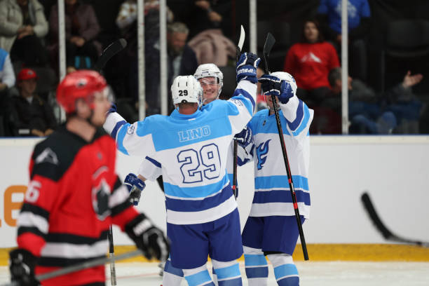 istock Hockey Team Celebrating a Goal 2187096300