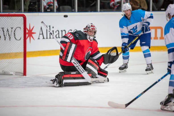 istock Ice hockey goalie defending the net 2187096336