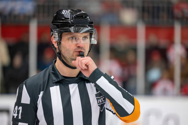 istock Ice Hockey Referee Blowing the Whistle During a Game 2187096359