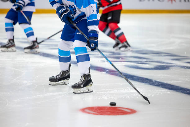 istock Hockey Player in Action: Hitting the Puck 2187096399
