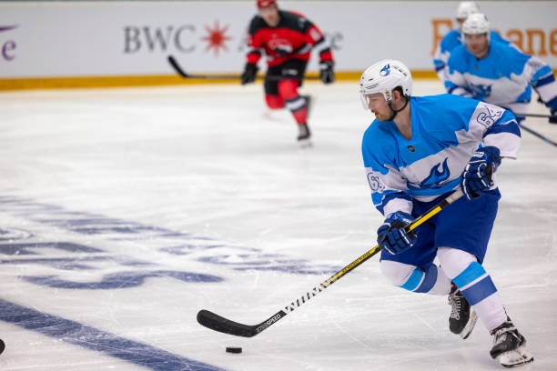 Ice Hockey Player in Action: Dribbling the Puck