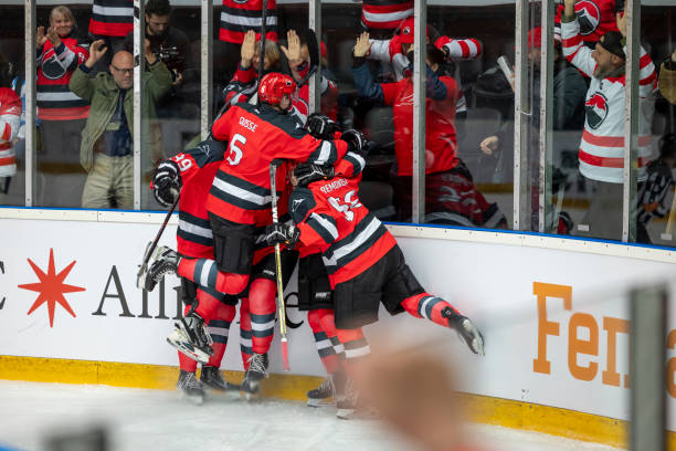 istock Hockey Team Celebrating Victory with Fans 2187096449
