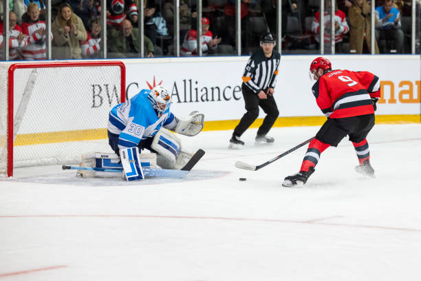 istock Ice Hockey Match: Player Skates Towards the Net 2187096491