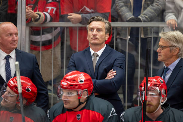 Hockey Coach with Team During Game