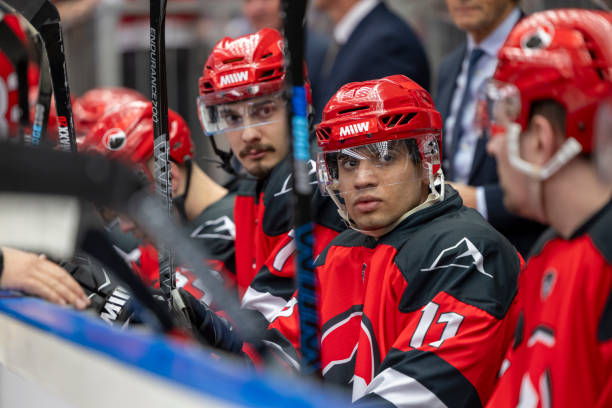 istock Hockey Players Observing the Game from the Bench 2187096599
