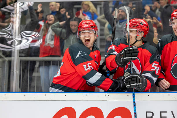 istock Ecstatic Hockey Players on the Bench 2187096650