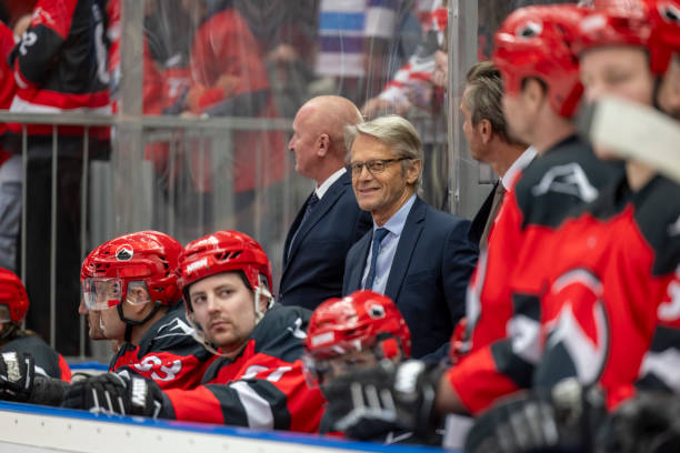 istock Hockey Coaches and Players on the Bench 2187096713