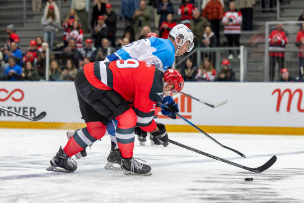 istock Ice Hockey Puck Battle 2187096749