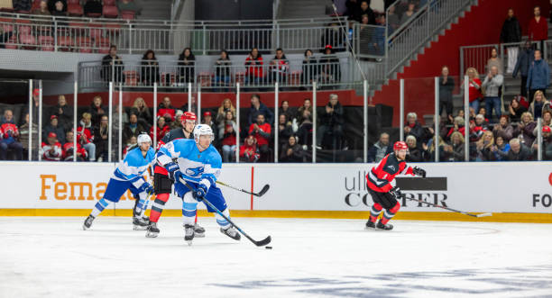 istock A Dynamic Play: Ice Hockey Players Control the Puck with Speed and Skill 2187096798