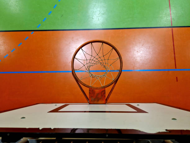 Sports hall with basketball hoop, foldable on the ceiling