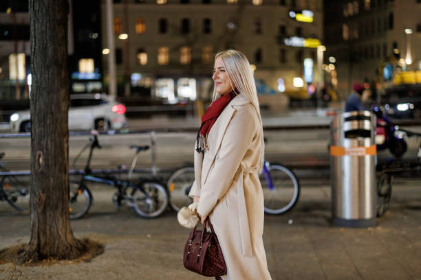 istock Woman enjoying winter evening city walk 2187097629